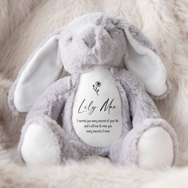A soft grey bunny toy with a personalised quote saying "I carried you every second of your life and I will love & miss you every second of mine".